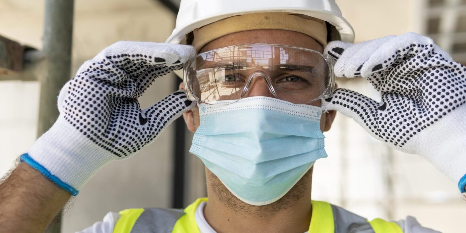 worker-wearing-safety-glasses-on-construction-site